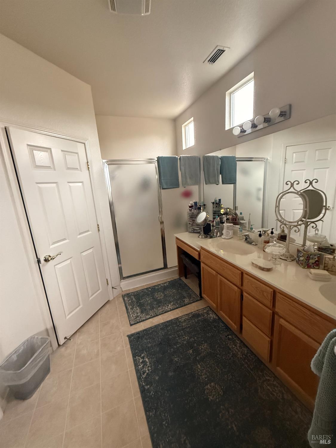 282 Cedar Ridge Drive Rio Vista, CA 94571 - Photo 6 of 8 a bathroom with a double vanity sink and mirror