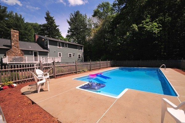 29 Johnson Road Sutton, MA 01590 - Photo 23 of 29 a view of a swimming pool with a patio and fire pit