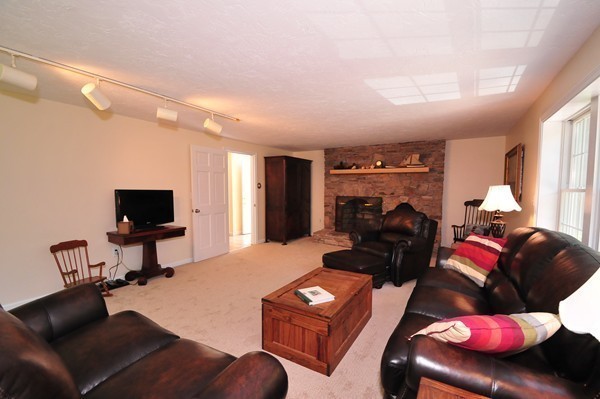 29 Johnson Road Sutton, MA 01590 - Photo 3 of 29 a living room with furniture and a flat screen tv