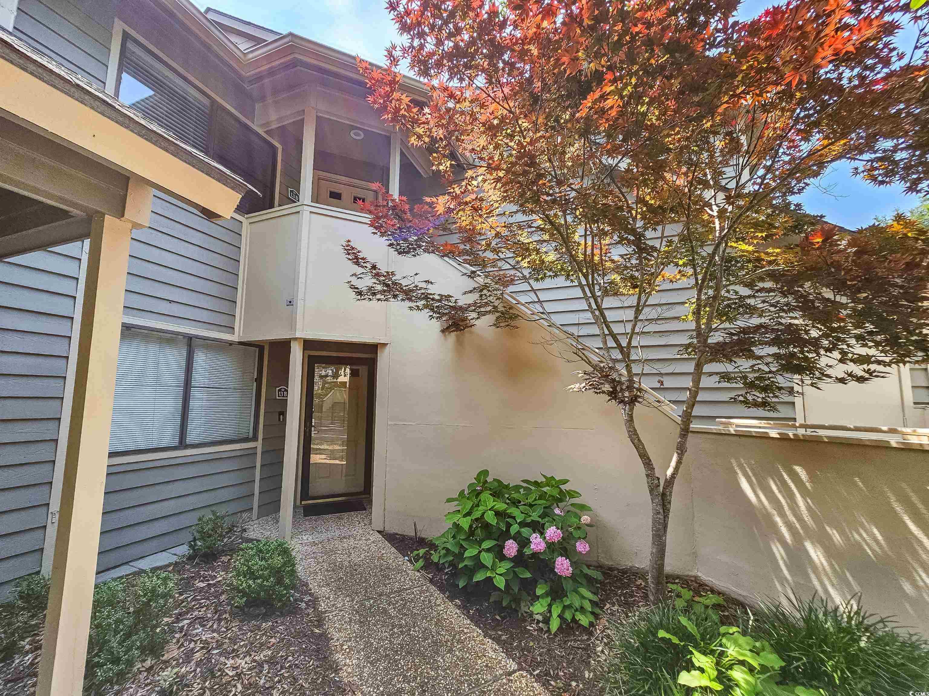 210 Westleton Drive, Unit 13D Myrtle Beach, SC 29572 - Photo 2 of 40 Doorway to property with stucco siding
