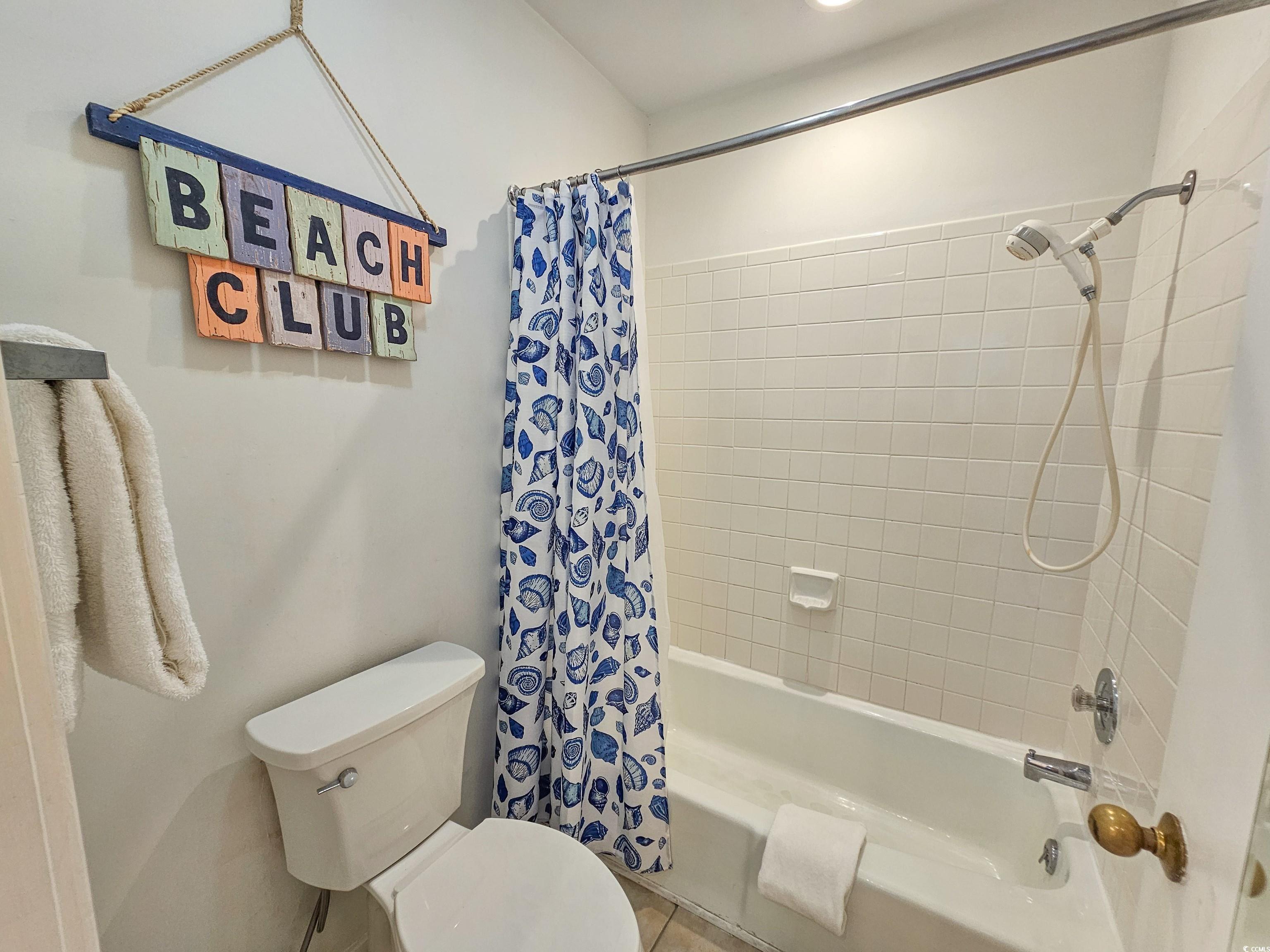 210 Westleton Drive, Unit 13D Myrtle Beach, SC 29572 - Photo 25 of 40 Bathroom with shower / tub combo, toilet, and tile patterned flooring