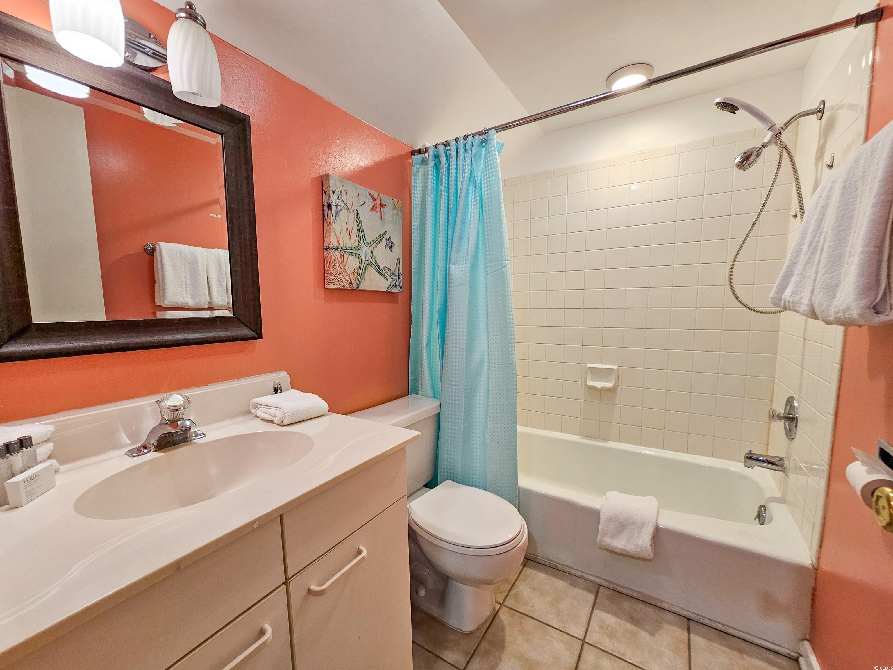 210 Westleton Drive, Unit 13D Myrtle Beach, SC 29572 - Photo 29 of 40 Full bathroom featuring tile patterned floors, vanity, shower / bath combination with curtain, and toilet