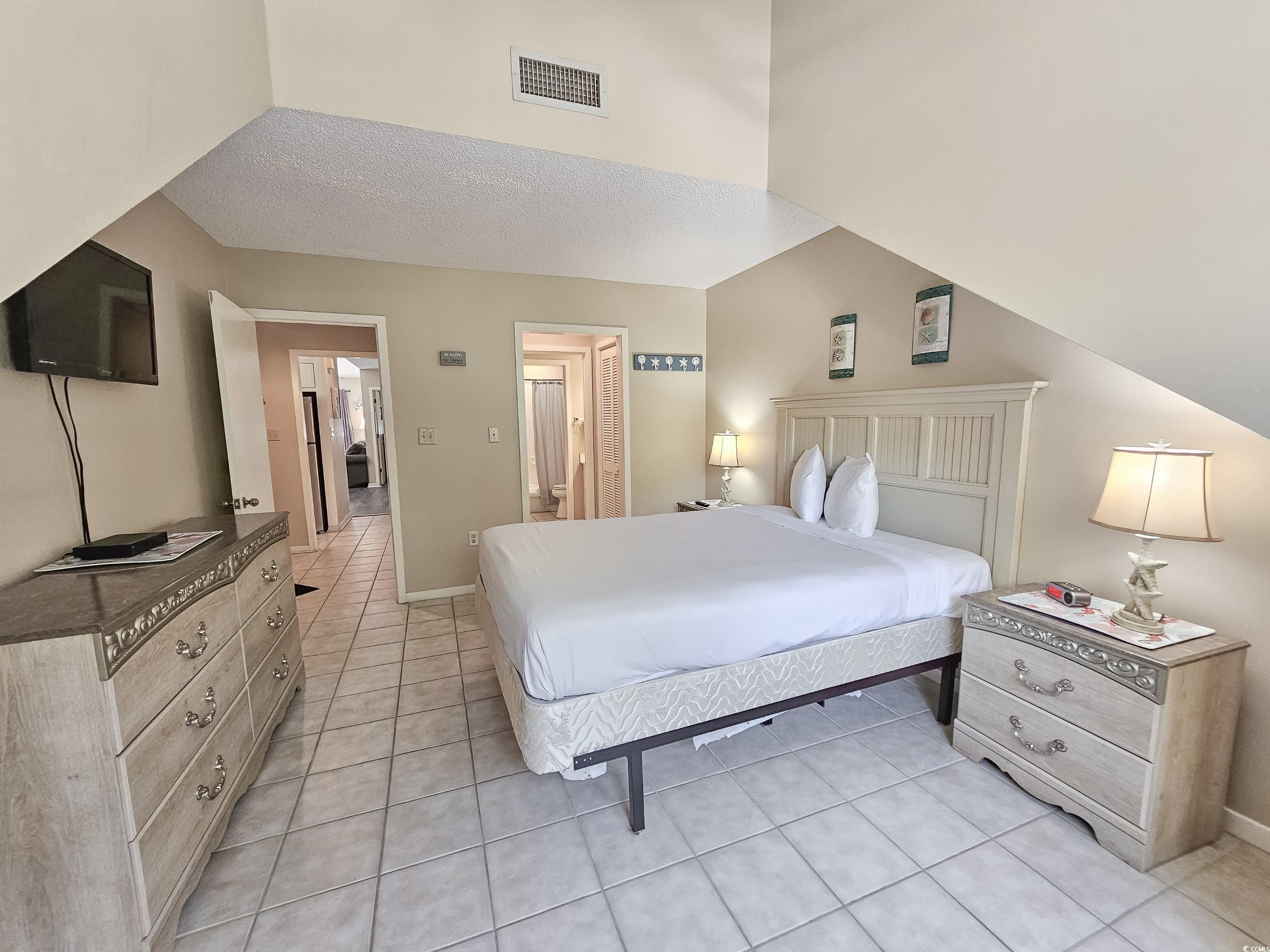 210 Westleton Drive, Unit 13D Myrtle Beach, SC 29572 - Photo 31 of 40 Bedroom featuring light tile patterned floors and baseboards