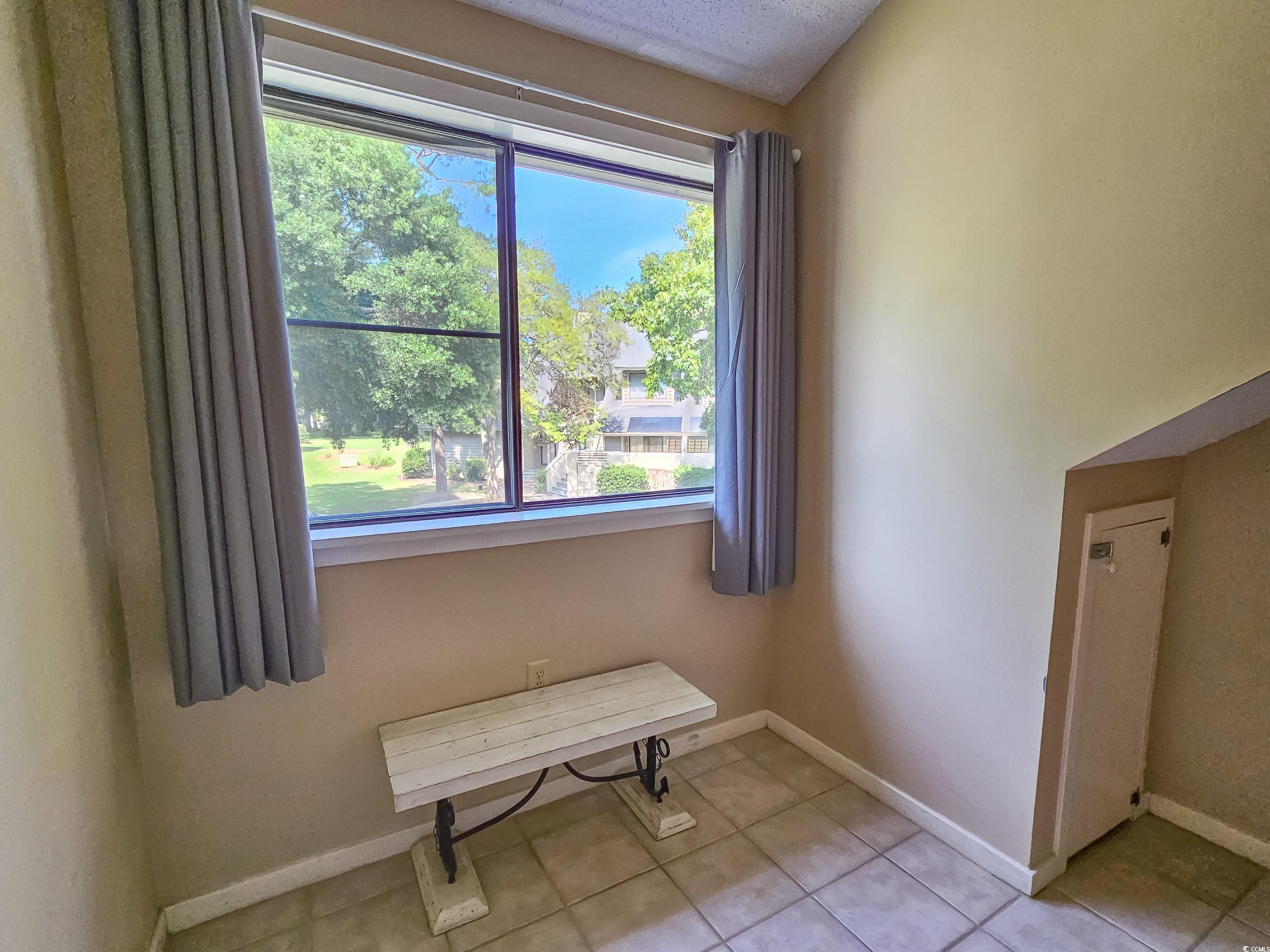 210 Westleton Drive, Unit 13D Myrtle Beach, SC 29572 - Photo 32 of 40 Empty room with baseboards and tile patterned floors