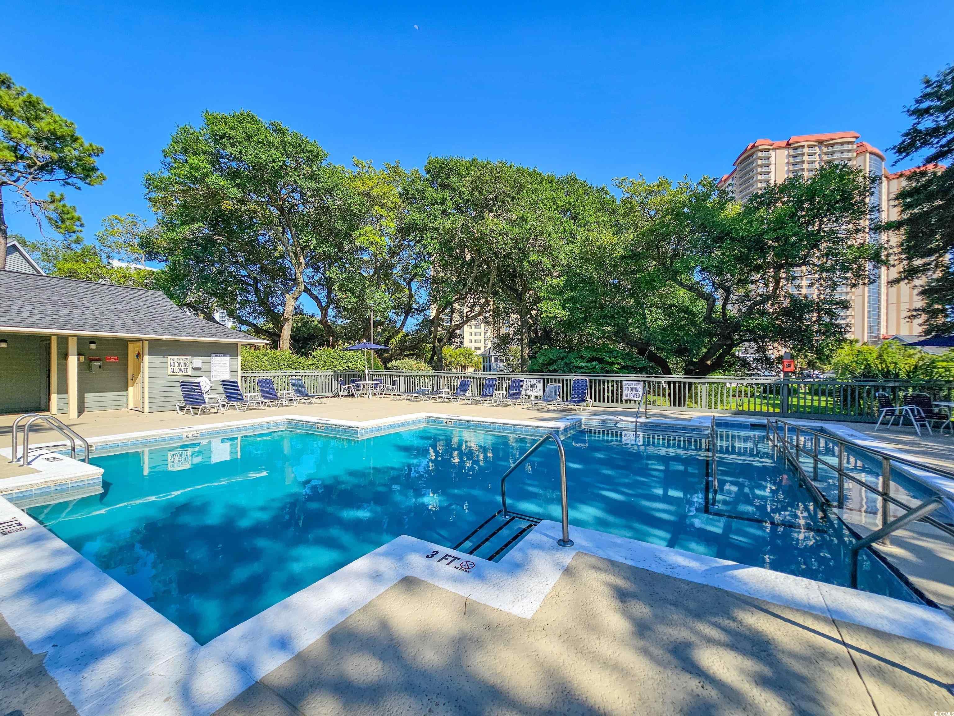 210 Westleton Drive, Unit 13D Myrtle Beach, SC 29572 - Photo 36 of 40 Community pool featuring a patio area