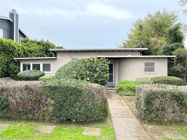 a house view with a garden space