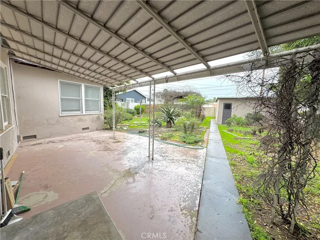 a view of a backyard with potted plants