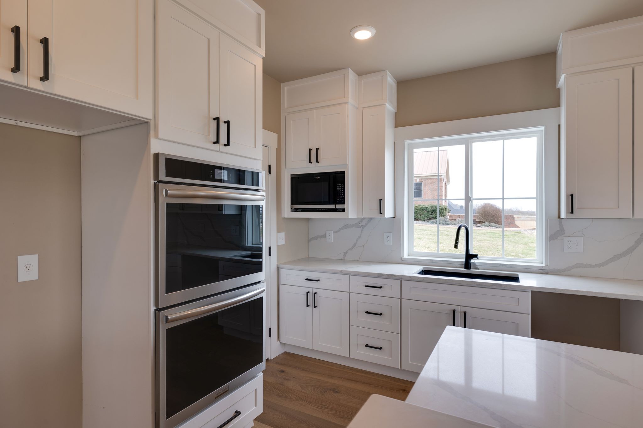 3010 Ora Lane Spring Hill, TN 37174 - Photo 12 of 33 a kitchen with granite countertop white cabinets and stainless steel appliances
