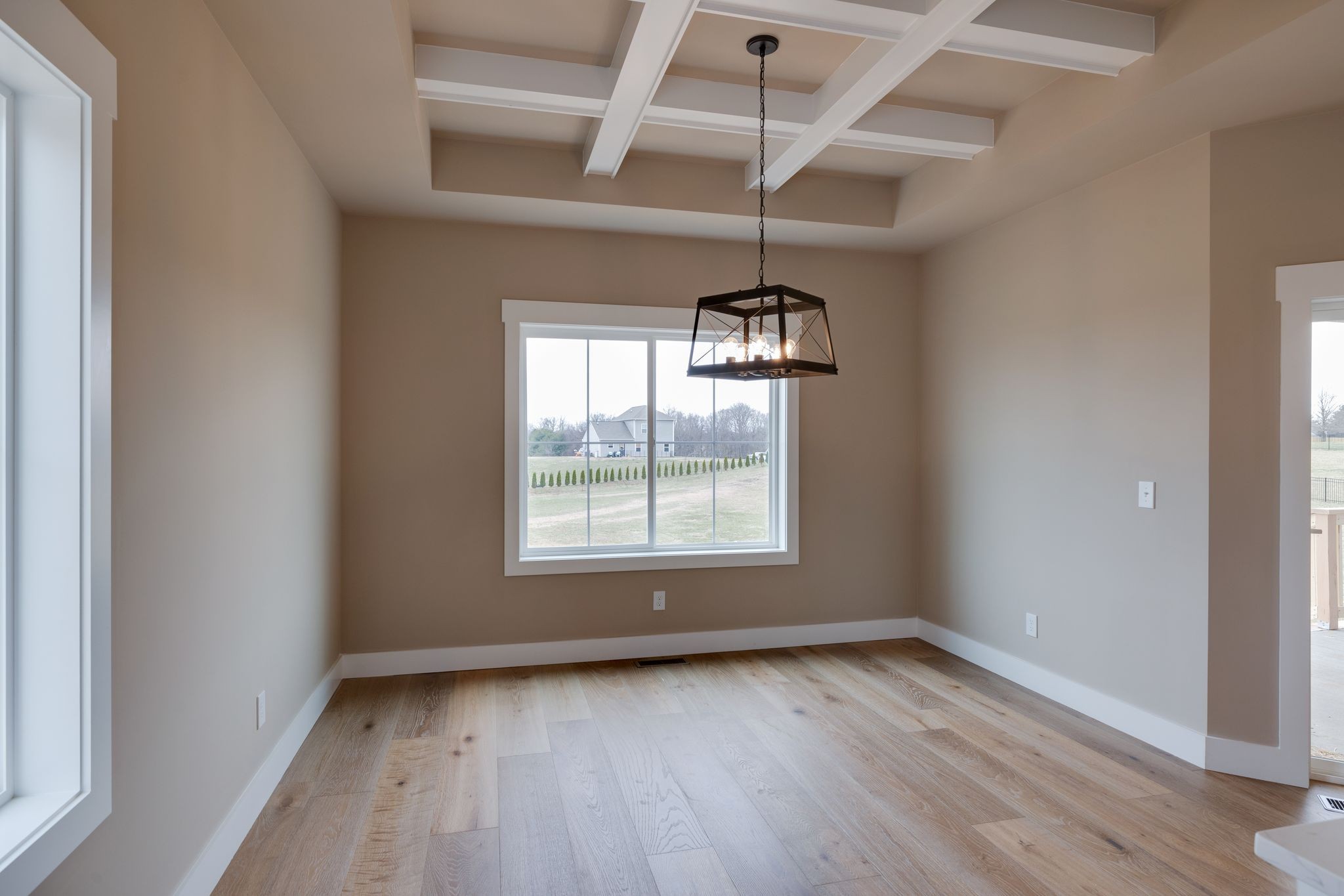 3010 Ora Lane Spring Hill, TN 37174 - Photo 14 of 33 an empty room with wooden floor chandelier and windows