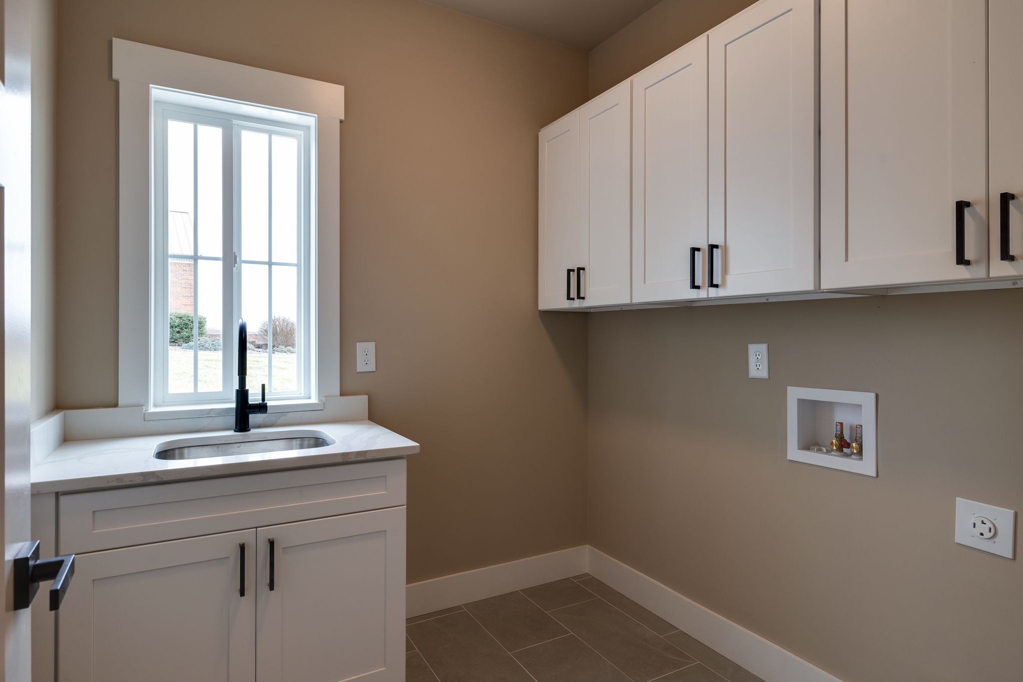 3010 Ora Lane Spring Hill, TN 37174 - Photo 20 of 33 a view of kitchen with granite countertop white cabinets and a window