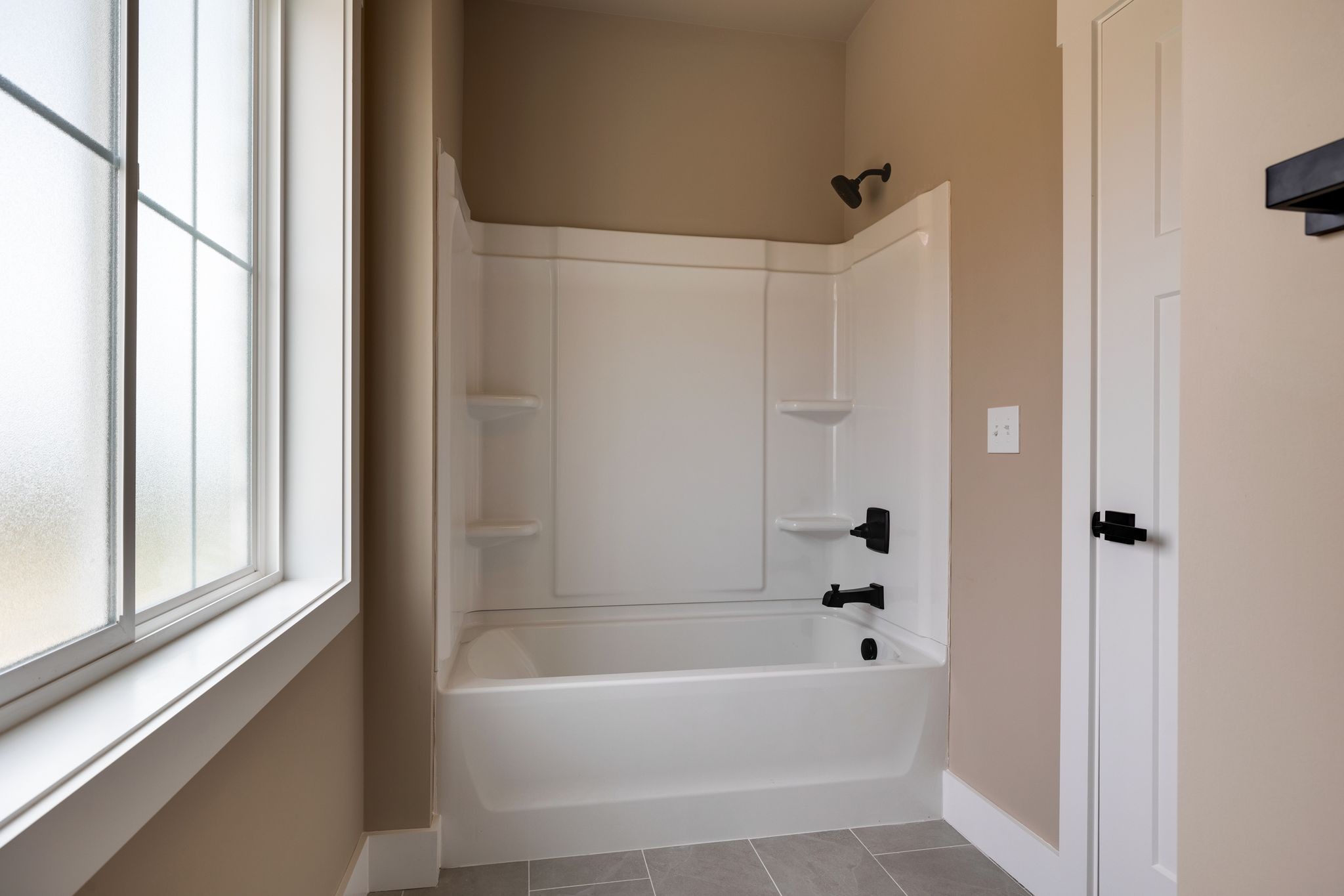 3010 Ora Lane Spring Hill, TN 37174 - Photo 24 of 33 a bathroom with a bathtub and a shower