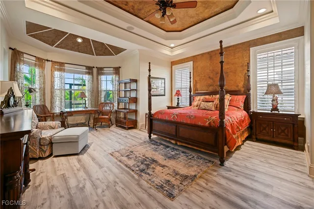a view of a hallway with wooden floor and windows