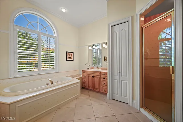 a living room with furniture kitchen view and a wooden floor