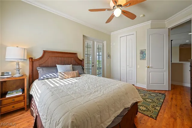 a bathroom with a sink a toilet a large mirror and shower
