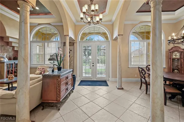 a living room with furniture fireplace and a large window