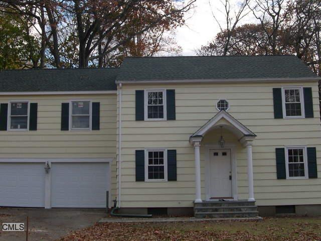 a front view of a house with garage