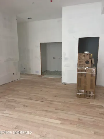 a view of a livingroom with wooden floor