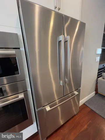 a bathroom with a sink a mirror and a toilet