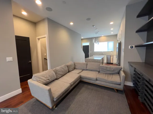a kitchen with granite countertop a sink and cabinets