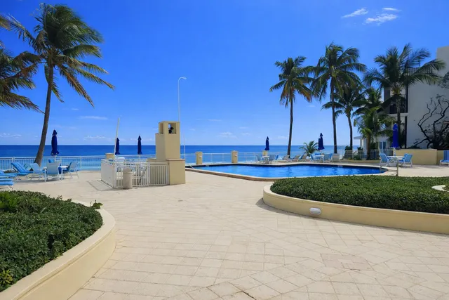 a view of a swimming pool with a house
