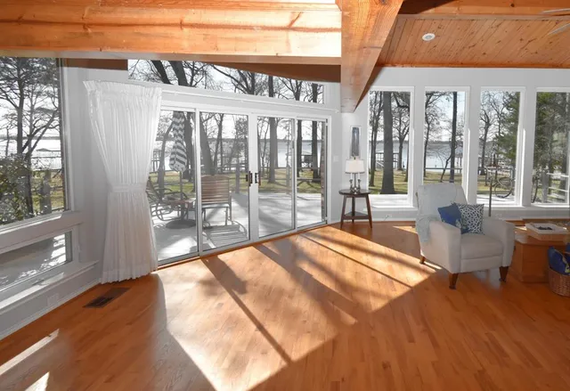 a view of a living room and balcony