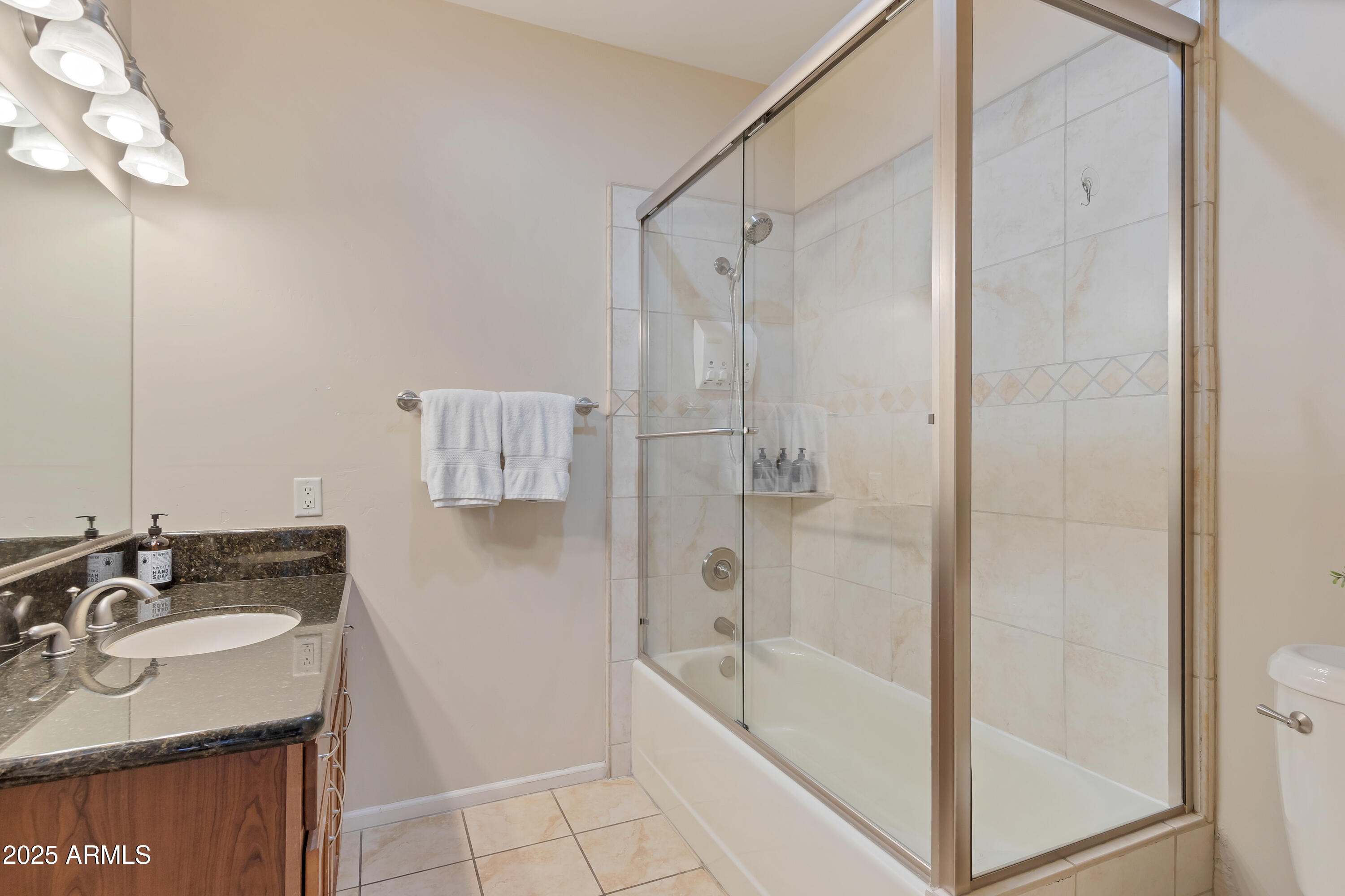 45 Canyon Diablo Road, Unit 4 Sedona, AZ 86351 - Photo 14 of 23 a bathroom with a granite countertop sink a toilet and shower