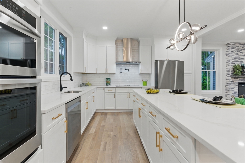 835 West Street Ludlow, MA 01056 - Photo 12 of 42 a kitchen with a sink and refrigerator