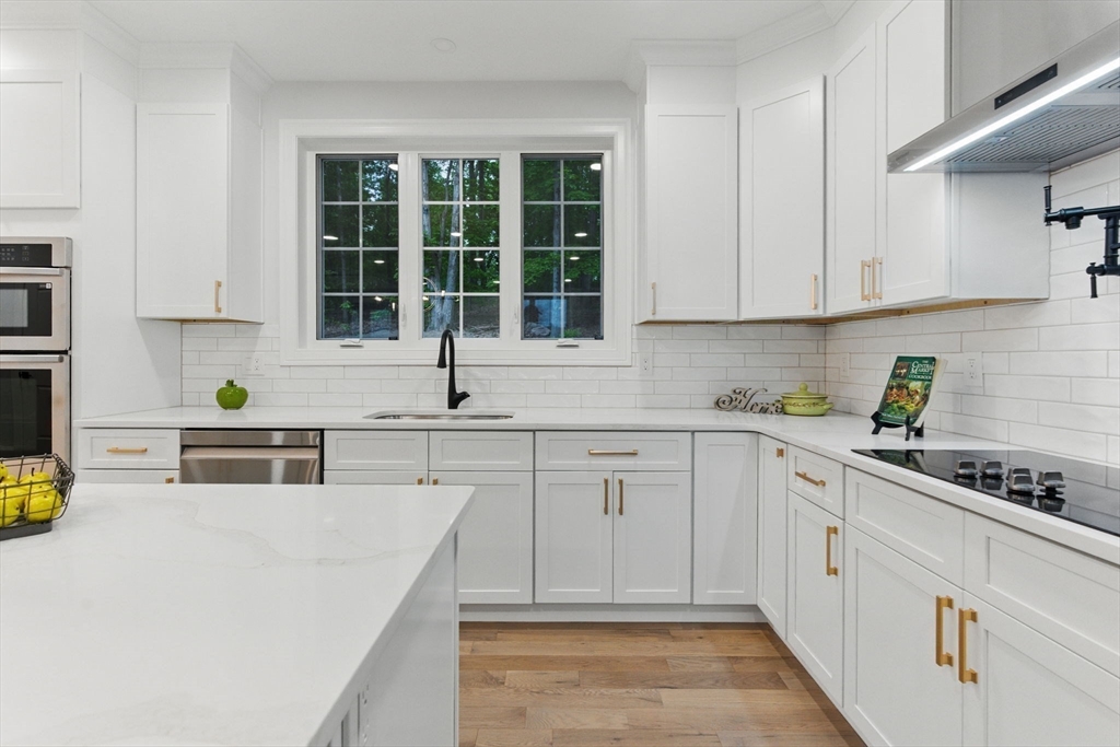 835 West Street Ludlow, MA 01056 - Photo 13 of 42 a kitchen with cabinets appliances and a window