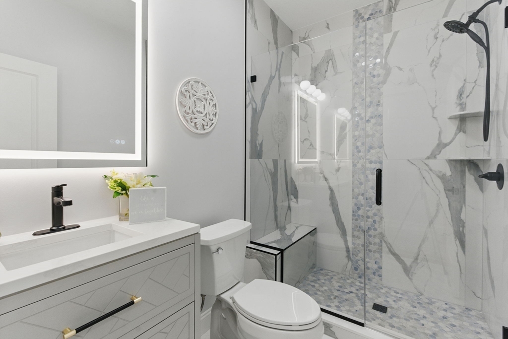 835 West Street Ludlow, MA 01056 - Photo 19 of 42 a bathroom with a sink a toilet and a shower