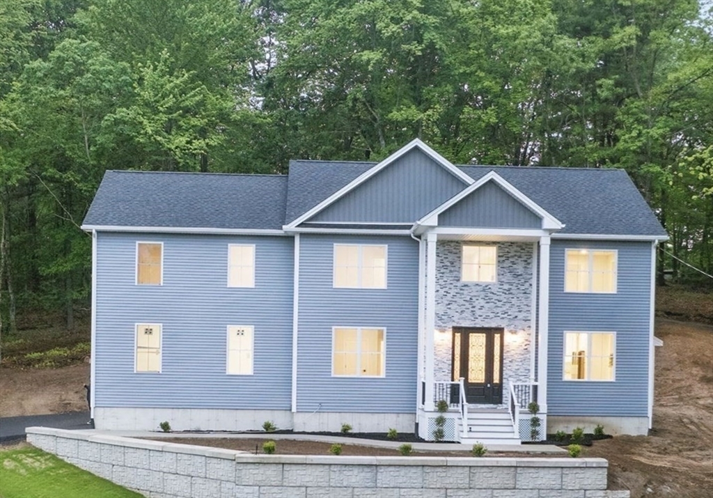 835 West Street Ludlow, MA 01056 - Photo 2 of 42 a front view of a house with yard