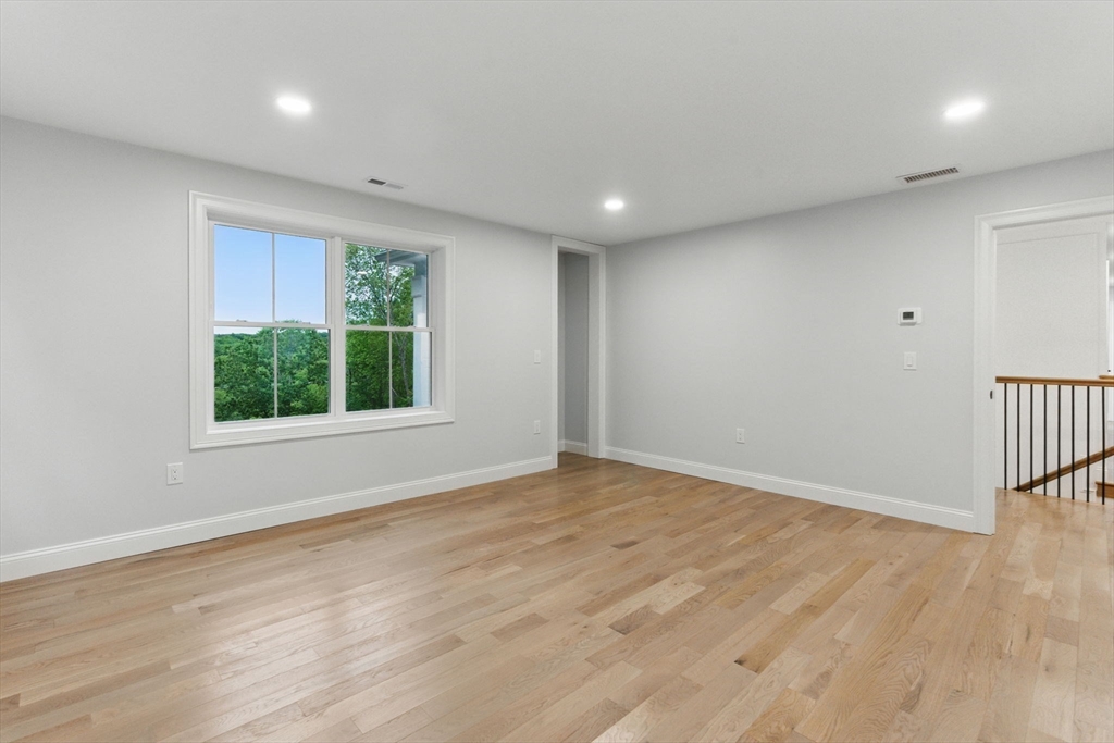 835 West Street Ludlow, MA 01056 - Photo 23 of 42 a view of an empty room with wooden floor and a window