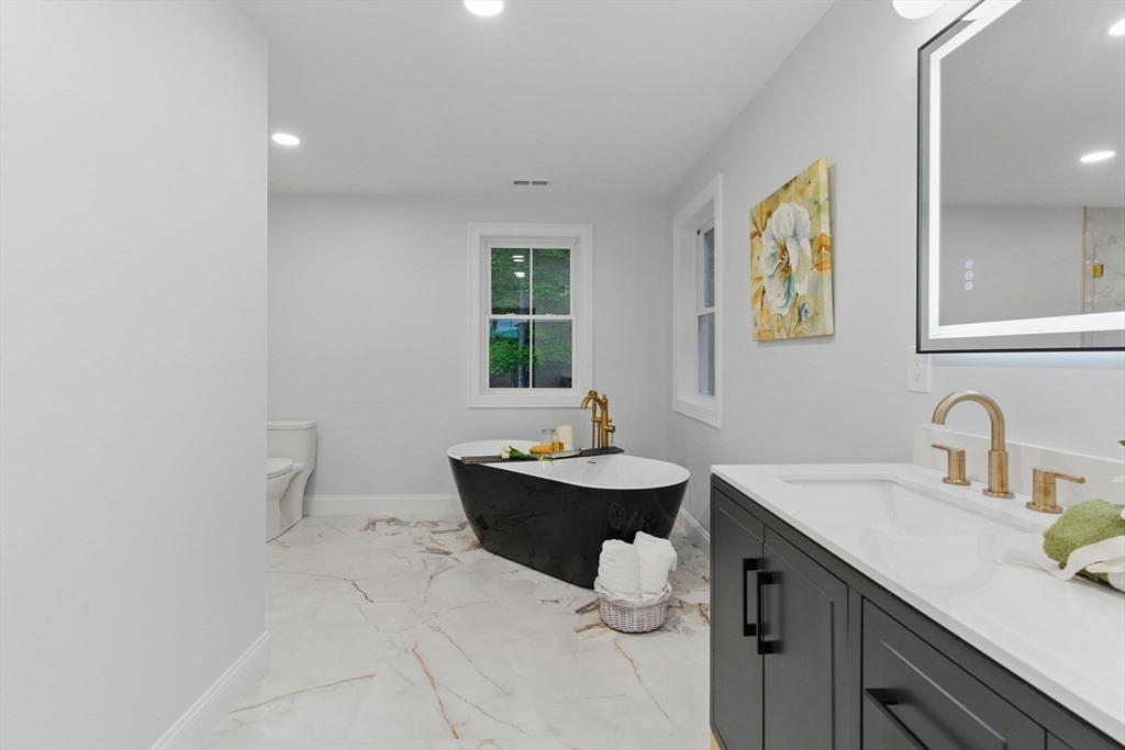 835 West Street Ludlow, MA 01056 - Photo 27 of 42 a bathroom with a sink and a mirror
