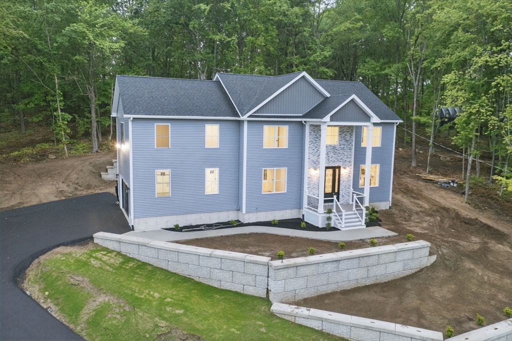 835 West Street Ludlow, MA 01056 - Photo 3 of 42 a front view of a house with a yard