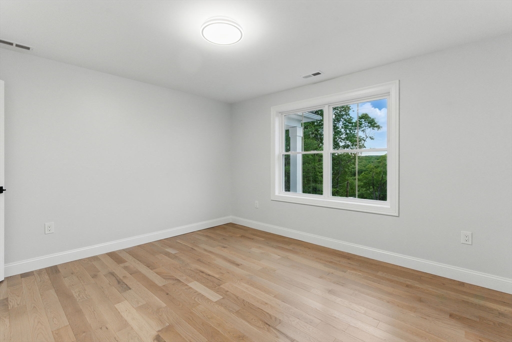 835 West Street Ludlow, MA 01056 - Photo 35 of 42 a view of an empty room with wooden floor and a window