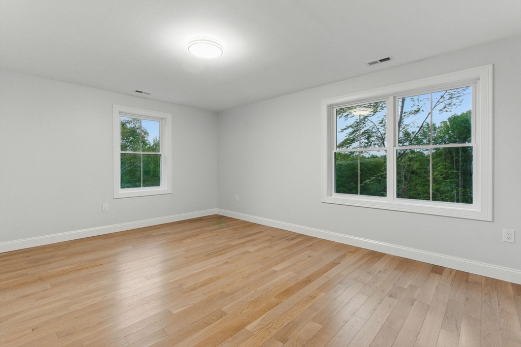 835 West Street Ludlow, MA 01056 - Photo 37 of 42 a view of an empty room with wooden floor and a window