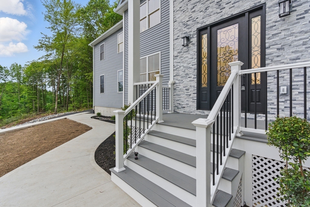 835 West Street Ludlow, MA 01056 - Photo 5 of 42 a view of balcony with wooden floor and fence