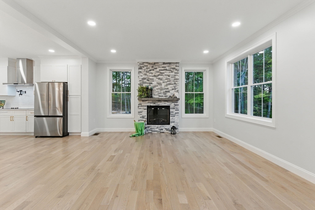 835 West Street Ludlow, MA 01056 - Photo 7 of 42 a view of empty room with a fireplace and windows