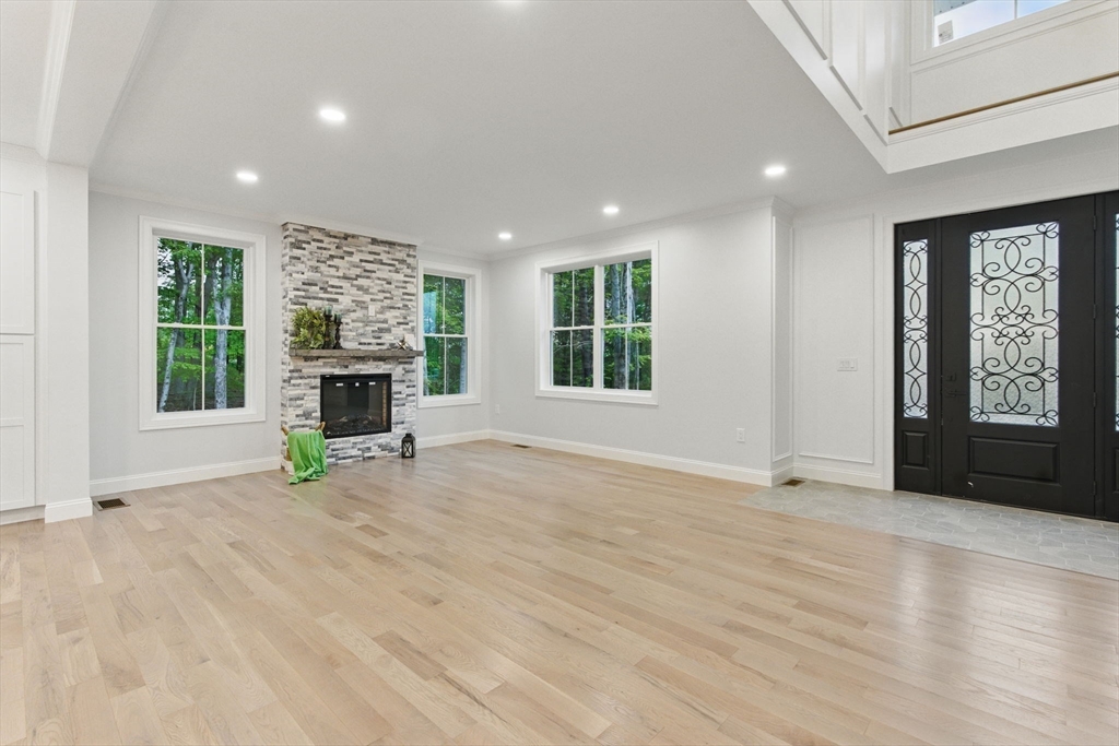 835 West Street Ludlow, MA 01056 - Photo 9 of 42 an empty room with furniture and a fireplace
