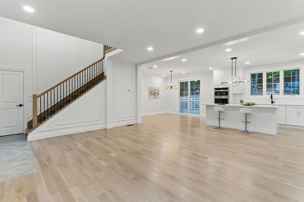 835 West Street Ludlow, MA 01056 - Photo 10 of 42 a view of an empty room with wooden floor and staircase