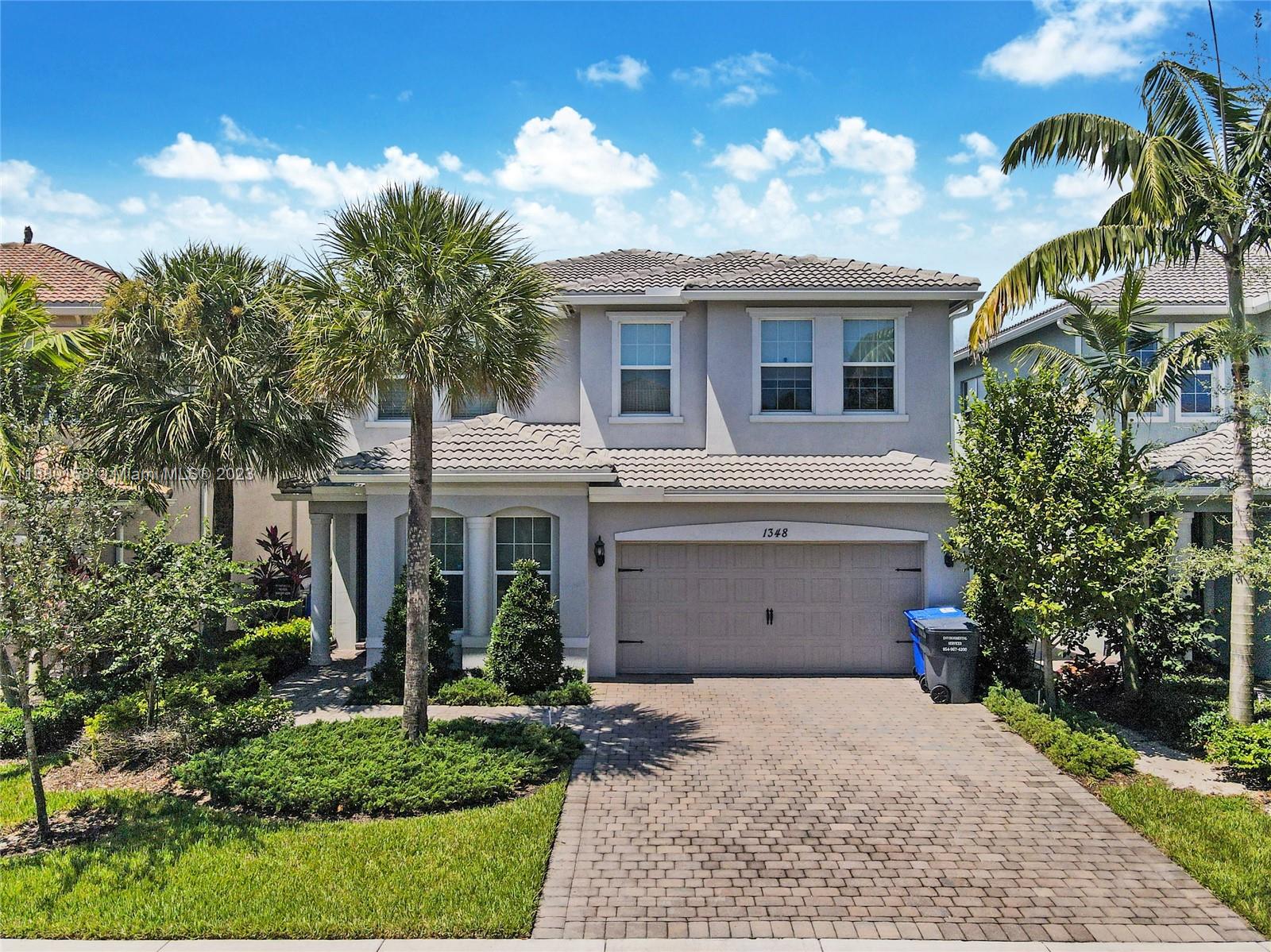 front view of a house with a garden