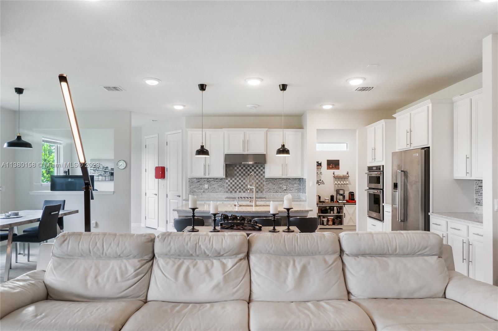 1348 Silk Oak Drive Hollywood, FL 33021 - Photo 13 of 33 a living room with furniture and kitchen view