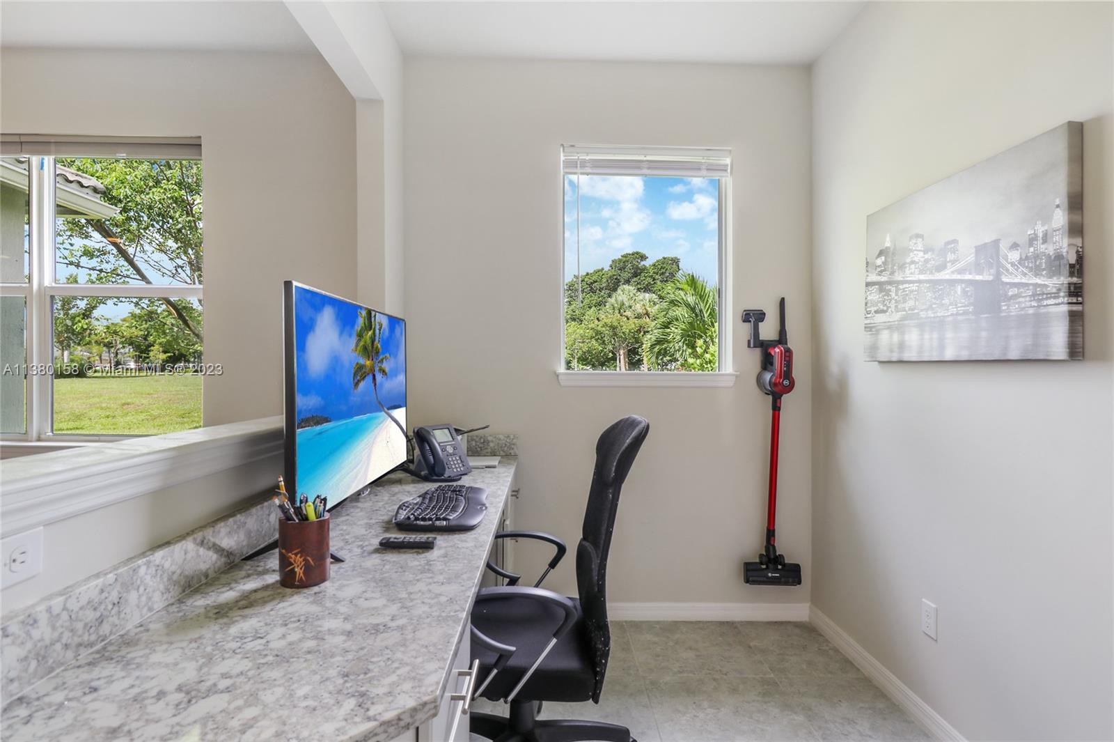 1348 Silk Oak Drive Hollywood, FL 33021 - Photo 14 of 33 a view of a workspace with furniture and a window