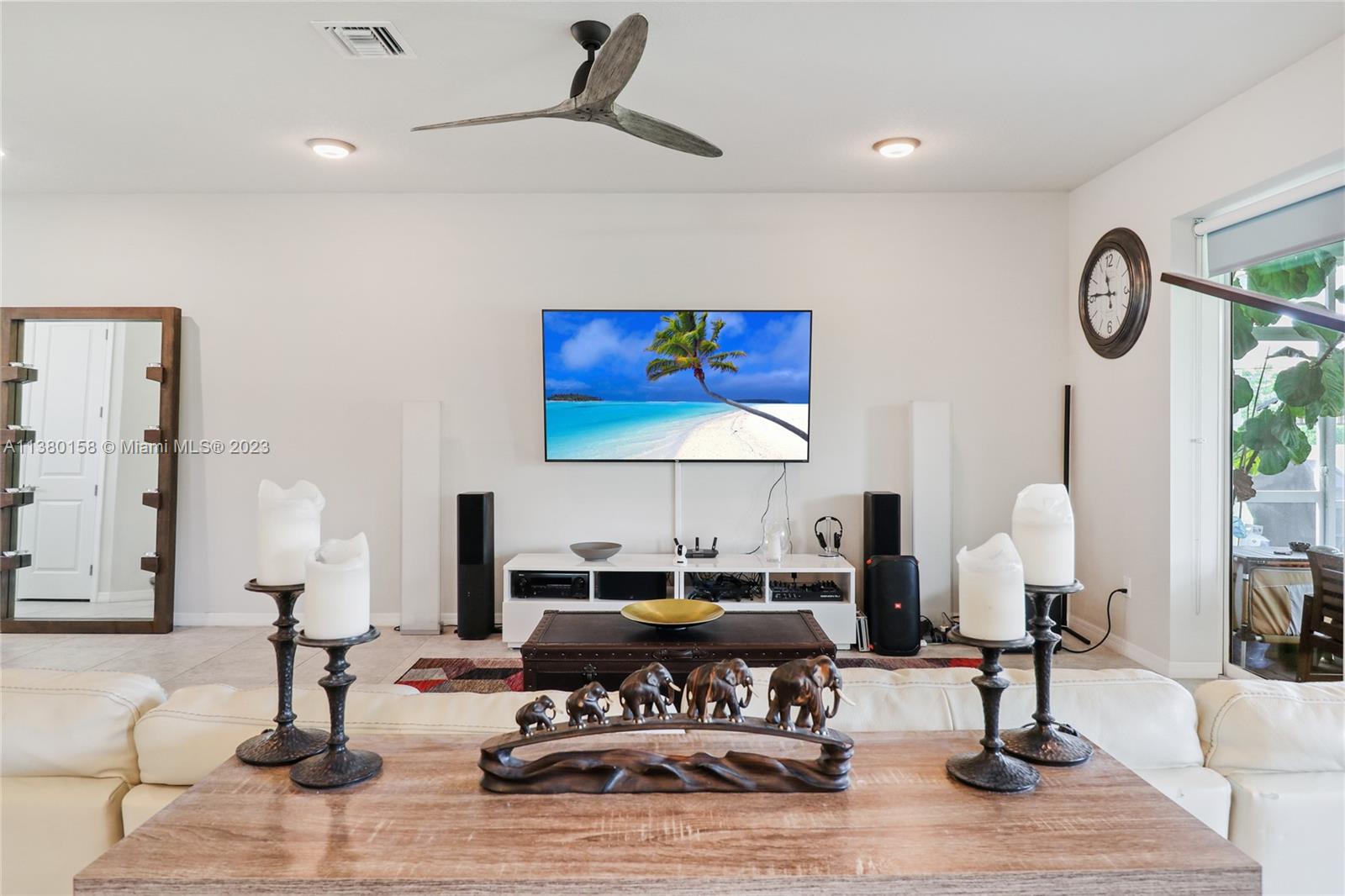 1348 Silk Oak Drive Hollywood, FL 33021 - Photo 20 of 33 a living room with furniture a lamp and a table