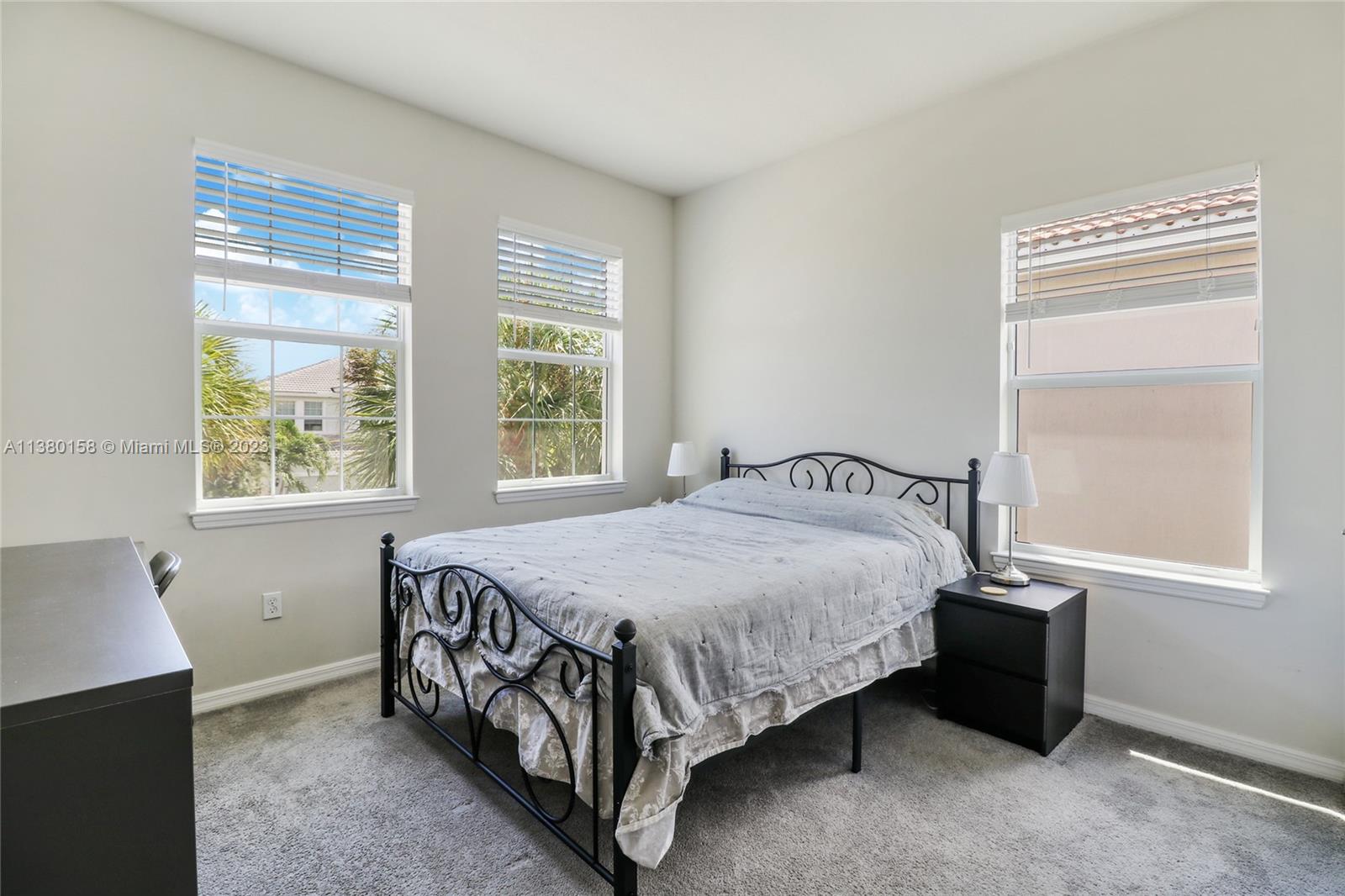 1348 Silk Oak Drive Hollywood, FL 33021 - Photo 24 of 33 a bedroom with a bed and window
