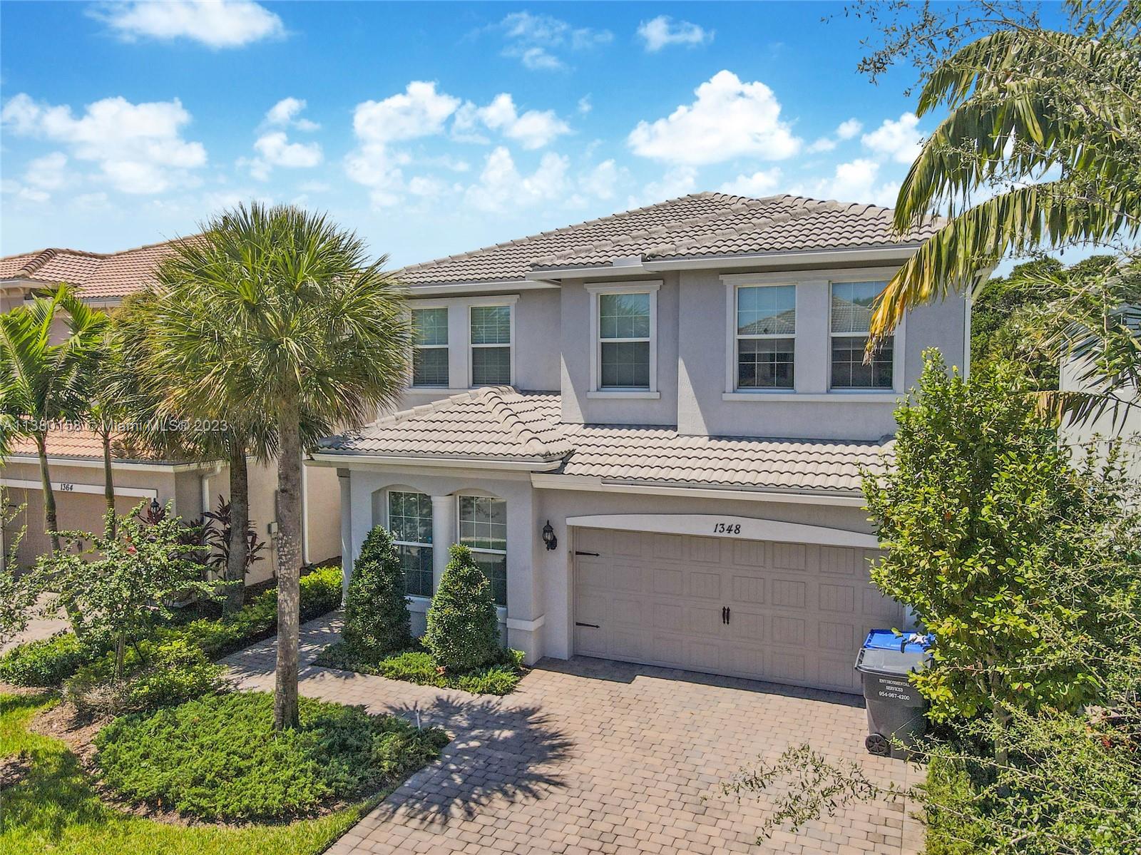 1348 Silk Oak Drive Hollywood, FL 33021 - Photo 3 of 33 a view of a house with a yard and plants