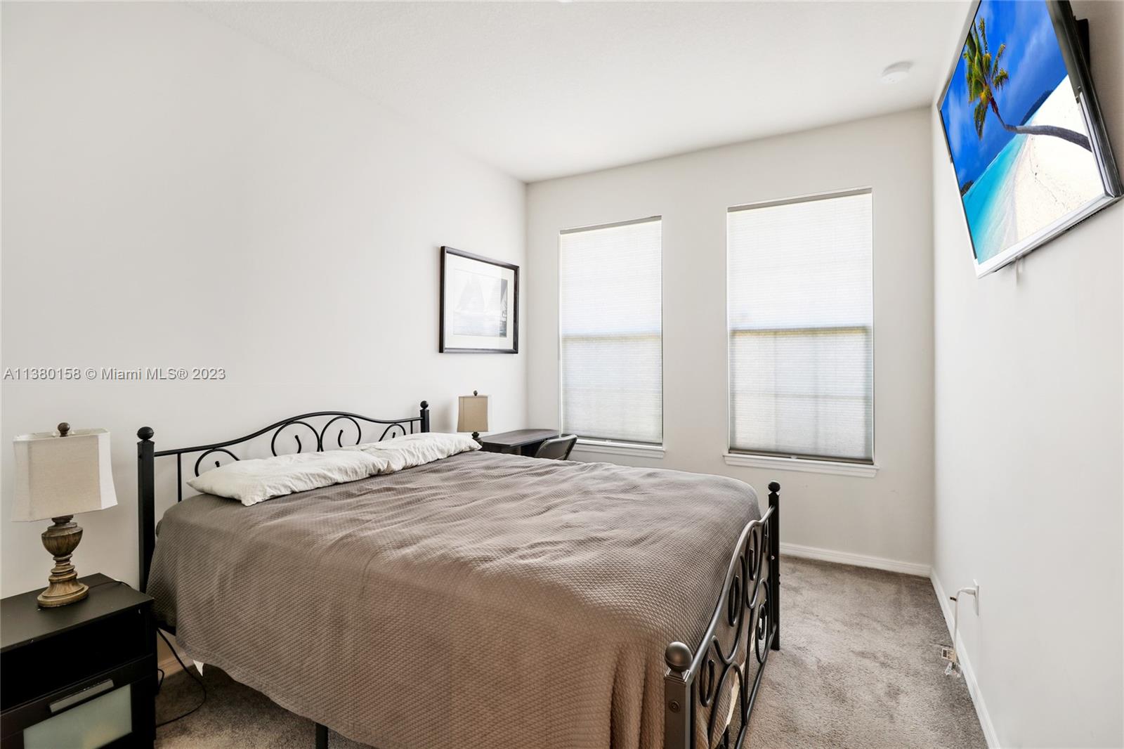 1348 Silk Oak Drive Hollywood, FL 33021 - Photo 31 of 33 a bedroom with a bed and a window