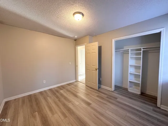 a view of a park with large trees