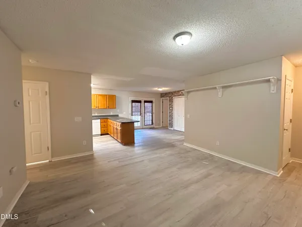 a view of a kitchen with a sink and a window