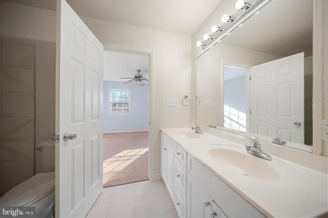 a bathroom with a shower and toilet