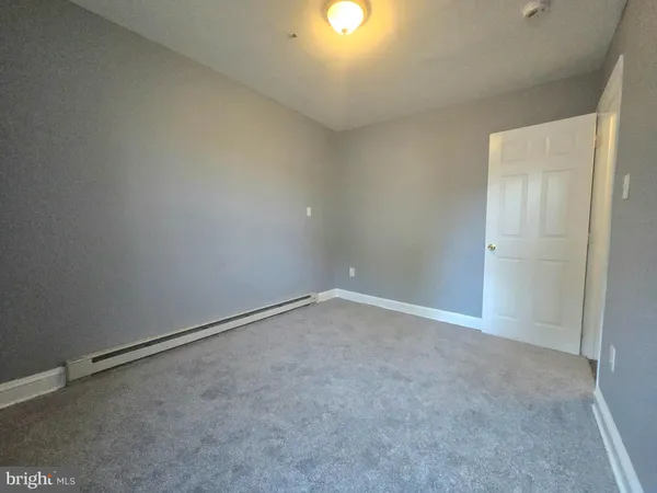 a kitchen with granite countertop a stove a sink and a microwave